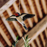 Carved Wooden Figure of a Barn Swallow in Flight by Wildlife Garden